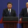 In this combination of Nov. 9, 2017 photos, U.S. President Donald Trump, right, and Chinese President Xi Jinping speak during a business event at the Great Hall of the People in Beijing. 