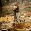 Chris and Nancy Brown embrace while searching through the remains of their home, leveled by the Camp Fire, in Paradise, Calif., on Monday, Nov. 12, 2018. 