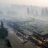 Smoke hangs over the scorched remains of Old Town Plaza following the wildfire in Paradise, Calif., on Thursday, Nov. 15, 2018