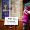 Sisters Alli Benefield, left, and Kassy Parish embrace during a vigil for the lives and community lost to the Camp Fire on Sunday, Nov. 18, 2018, at the First Christian Church of Chico in Chico