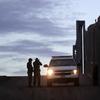 United States Border Patrol agents stand by a vehicle near one of the border walls separating Tijuana, Mexico and San Diego Wednesday, Nov. 21, 2018, in San Diego. 