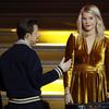 In this photo taken Monday Dec.3, 2018, French DJ and musician Martin Solveig, left, talks to Olympique Lyonnais' Ada Hegerberg, of Norway, during the Golden Ball 