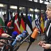 British Prime Minister Theresa May speaks with the media as she arrives for an EU summit in Brussels, Thursday, Dec. 13, 2018. 