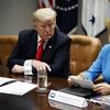President Donald Trump listens as Secretary of Education Betsy DeVos speaks during a roundtable discussion on the Federal Commission on School Safety report