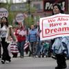 Demonstrators march through downtown Chicago Monday, May 1, 2006, to show support for immigrant rights. 