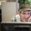 In this Oct. 20, 2014 photo, unemployed coal miner Eddie Jones looks for jobs on a computer at the Kentucky Career Center in Harlan, Ky. 