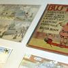 An exhibit of political and editorial cartoon artwork from the mid-19th century through the 1960s is seen on display at Syracuse University in Syracuse, N.Y.