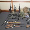 This image provided by the U.S. District Court in Maryland shows a photo of firearms and ammunition that was in the motion for detention pending trial in the case against Christopher Paul Hasson. 