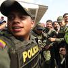 Colombian police escort a Venezuelan soldier who surrendered at the Simon Bolivar international bridge, where Venezuelans tried to deliver humanitarian aid 