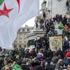 Demonstrators carrying the national Algerian flags stage a protest on the Republique Plaza to press for an end to the 20-year-rule of Algerian President Abdelaziz Bouteflika, in Paris, France, Sunday