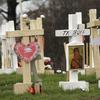 In this Thursday, Feb. 7, 2019, photo, the names of those who died in the Camp Fire are displayed on crosses that make up a memorial in Paradise, Calif. 