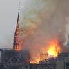 Flames rise from Notre Dame cathedral as it burns in Paris, Monday, April 15, 2019. 