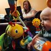 Five-month-old Oliver Michael DiCicco plays as his mother Sheri Lee Schearer, 34, works nearby at a computer Friday, April 8, 2011, in Pennsville, N.J.
