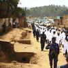 Doctors and health workers march in the Eastern Congo town of Butembo on Wednesday April 24, 2019, after attackers last week shot and killed an epidemiologist from Cameroon who was working for WHO.