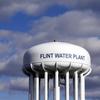 In this March 21, 2016 file photo, the Flint Water Plant water tower is seen in Flint, Mich.