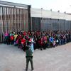 This May 29, 2019 file photo released by U.S. Customs and Border Protection (CBP) shows some of 1,036 migrants who crossed the U.S.-Mexico border in El Paso, Texas.