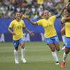 Brazil's Cristiane, second from right, celebrates with teammates after scoring her side's third goal during the Women's World Cup Group C soccer match between Brazil and Jamaica in Grenoble, France.