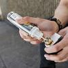In this Monday, June 17, 2019, photo, Jacky Chan, 23, refills his electronic cigarette with vaping liquid in San Francisco. 