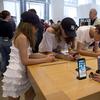 In this Aug. 2, 2018, file photo customers browse in an Apple store in New York.