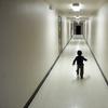 An asylum-seeking boy from Central America runs down a hallway after arriving from an immigration detention center to a shelter in this 2018 file photo.