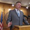 Alaska Gov. Mike Dunleavy speaks to reporters about his budget vetoes at the state Capitol in Juneau on June 28, 2019.