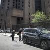 New York City medical examiner personnel leave their vehicle and walk to the Manhattan Correctional Center where financier Jeffrey Epstein died by suicide. 