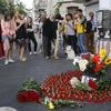 People pay tribute at a murder site of prominent journalist Pavel Sheremet in Kiev, Ukraine, Thursday, July 20, 2017. 