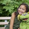 Image released by Sesame Workshop shows 10-year-old Salia Woodbury, whose parents are in recovery, with 'Sesame Street' character Karli. 