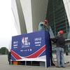 Workers dismantle signage for an NBA fan event scheduled to be held on Wednesday night at the Shanghai Oriental Sports Center in Shanghai, China, Tuesday, Oct. 8, 2019.