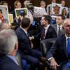Boeing CEO Dennis Muilenburg, right foreground, watches as family members hold up photographs of those killed in the Ethiopian Airlines Flight 302 and Lion Air Flight 610 crashes during a hearing.