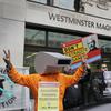 Supporters of Wikileaks founder Julian Assange demonstrate outside Westminster Magistrates' Court in London.