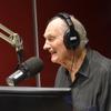alan alda in a studio laughing