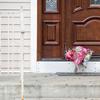 Flower bouquets rest on the doorstep of a rabbi's residence in Monsey, N.Y., Sunday, Dec. 29, 2019, following a stabbing Saturday night during a Hanukkah celebration.