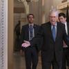 Senate Majority Leader Mitch McConnell, R-Ky., arrives for a closed meeting with fellow Republicans as he strategizes about the looming impeachment trial of President Donald Trump, at the Capitol in W