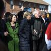 Democratic presidential rivals Amy Klobuchar, Elizabeth Warren and Bernie Sanders link arms during a Martin Luther King Jr. Day march on Monday, Jan. 20, 2020, in Columbia, S.C.