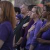 Attendees stand in support of domestic violence victims and survivors at the 5th Annual Lighting Arizona Purple Event.