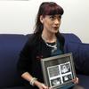 Remee Jo Lee, who had a miscarriage after her ex-boyfriend tricked her into taking abortion drugs, holds sonogram images of the child she lost 