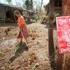 The sign in the foreground warns of the danger of land mines. Following 30 years of civil war, Cambodia is considered one of the most heavily-mined areas in the world. 