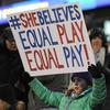  In this April 6, 2016, file photo, a girl holds up a sign for equal pay for the U.S. women soccer players.