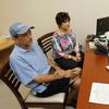 In this photo taken Wednesday, May 16, 2012, Dr. Pamela Sutton, right, talks to patient Carol Delzatto, center, and her husband Paul Delzatto at Broward General Hospital in Fort Lauderdale, Fla.