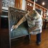 Mary Spoto, general manager of Madison Chop House Grille, changes the sign as she and her staff prepare to shift from take out only to dine-in service Monday, April 27, 2020, in Madison, Ga.