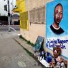 In this Dec. 30, 2014, file photo, a street side memorial with a painted portrait of Ezell Ford near where he was shot when police confronted him on Aug. 11, 2014, is shown on a street near his home.