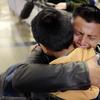 David Xol-Cholom, of Guatemala hugs his son Byron at Los Angeles International Airport as they reunite after being separated about one and half years ago during the Trump administration.