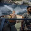 This image released by Warner Bros. Entertainment shows Elizabeth Debicki, left, and John David Washington in a scene from 'Tenet.'