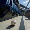 In this Sunday, July 26, 2020, file photo, a foul ball that was hit into the stands sits on the ground of an empty stadium during the eighth inning of a Miami Marlins game.