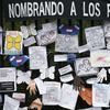 Tributes to lost love ones adorn a fence outside Brooklyn's Green-Wood Cemetery where many victims of COVID-19 are buried, Thursday, May 28, 2020 in New York. 