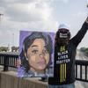 A protester poses for a photo during the Good Trouble Tuesday march for Breonna Taylor on Tuesday, Aug. 25, 2020, in Louisville, Ky. 