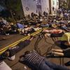 Demonstrators lie in the street Thursday, Sept. 3, 2020, at the site where Daniel Prude was restrained by police in Rochester, N.Y. 