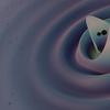 two black dots resembling black holes coming together in the middle of a purple swirl