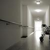 a lone walker in an empty hallway
